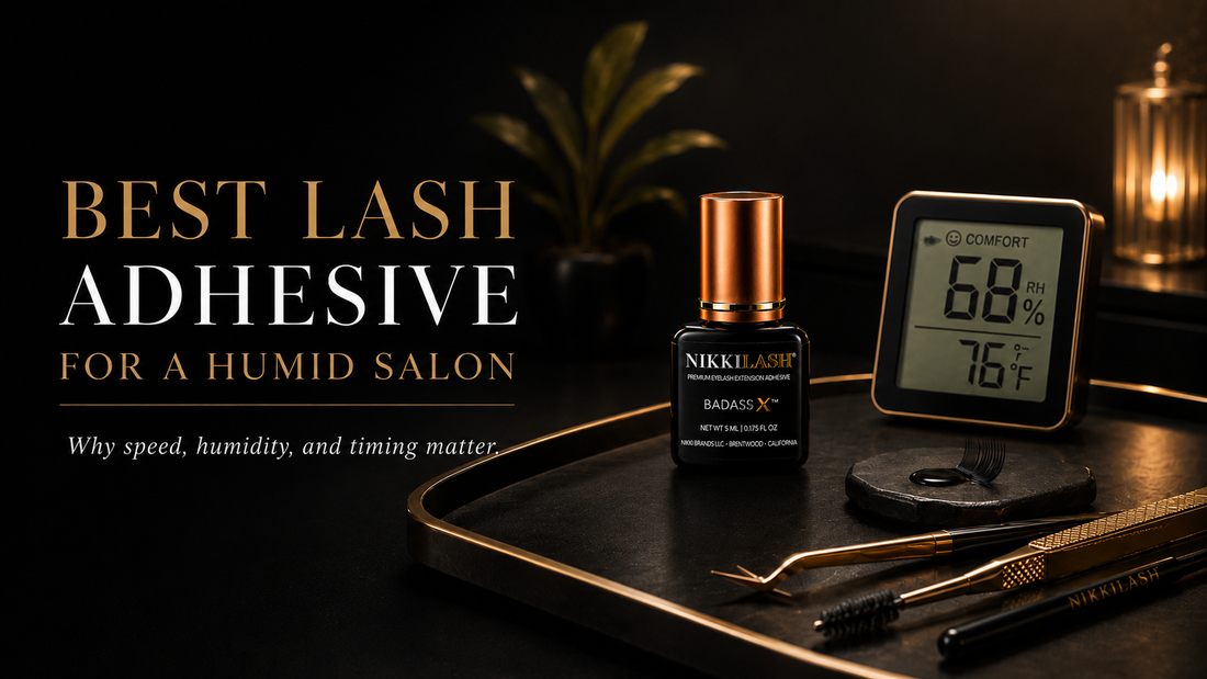 NikkiLash BADASS X lash adhesive blog banner featuring the BADASS X bottle beside a digital hygrometer, with the headline “Best Lash Adhesive for a Humid Salon” in a dark luxury studio setting.